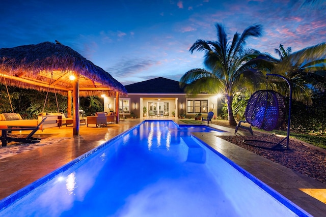 pool featuring a gazebo, a patio, french doors, and outdoor lounge area