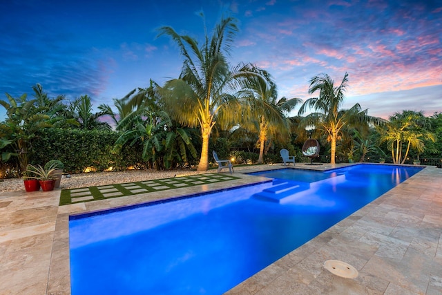 outdoor pool featuring a patio