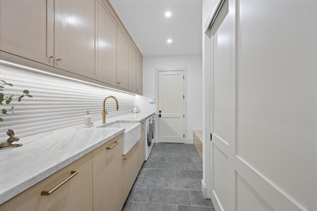 laundry room featuring cabinet space, washer and dryer, and recessed lighting