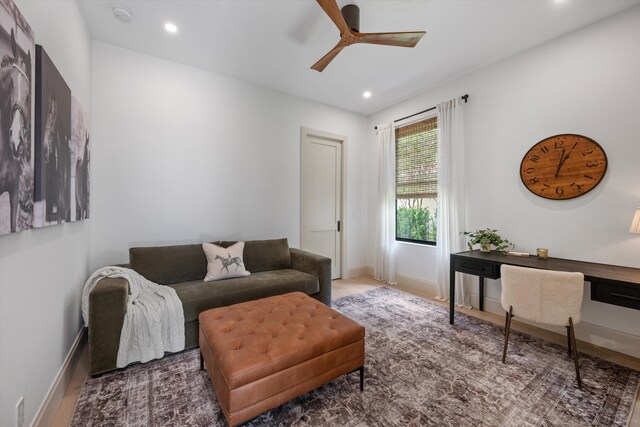 living area with ceiling fan, recessed lighting, and baseboards
