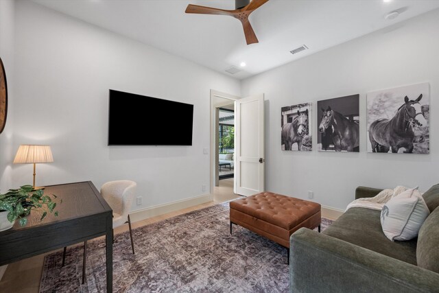 living room with recessed lighting, wood finished floors, a ceiling fan, and baseboards