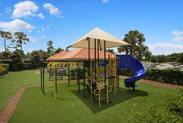 view of play area featuring a lawn and central air condition unit