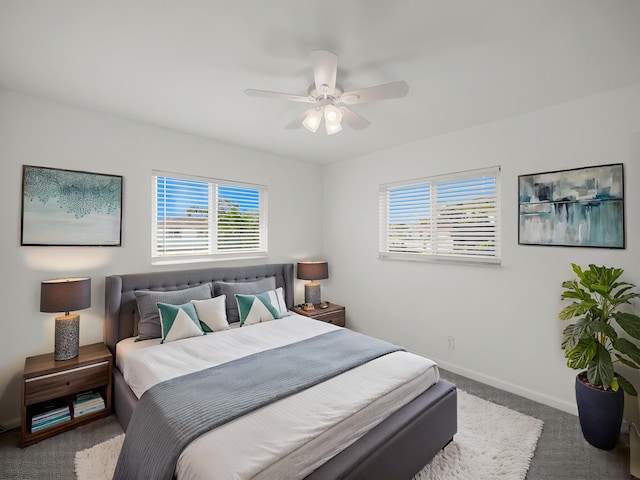 bedroom with carpet floors, baseboards, and a ceiling fan