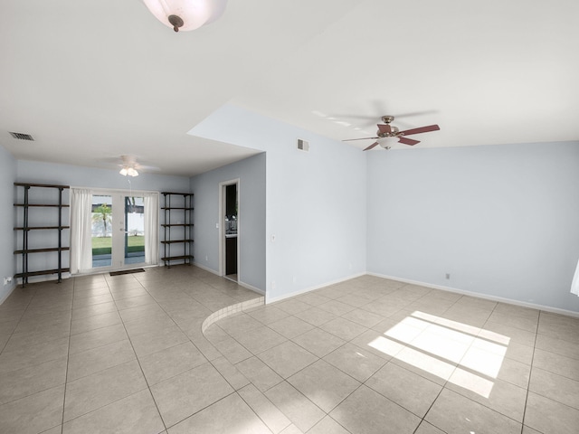 unfurnished room featuring ceiling fan and light tile patterned flooring