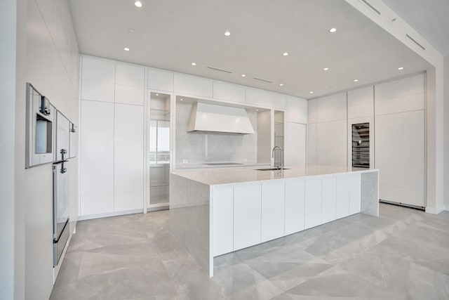 220 SE Mizner Blvd Unit Ph920, Boca Raton, FL 33432 - kitchen with custom range hood, modern cabinets, a sink, light countertops, and recessed lighting