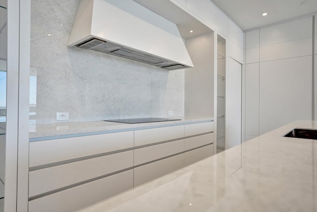 220 SE Mizner Blvd Unit Ph920, Boca Raton, FL 33432 - kitchen with premium range hood, black electric stovetop, light countertops, modern cabinets, and recessed lighting