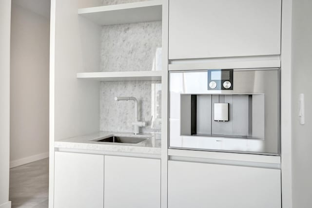 220 SE Mizner Blvd Unit Ph920, Boca Raton, FL 33432 - kitchen with open shelves, a sink, white cabinetry, modern cabinets, and baseboards