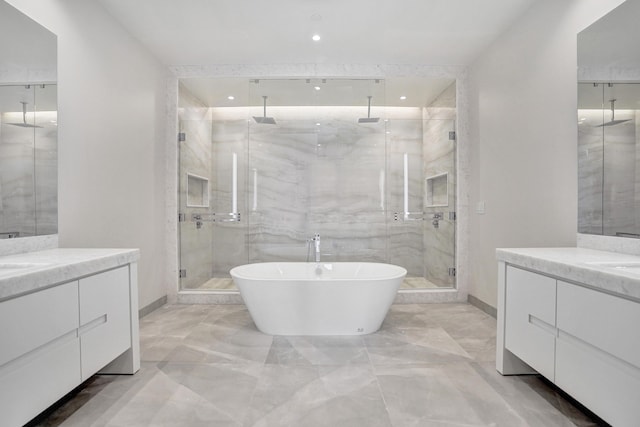 220 SE Mizner Blvd Unit Ph920, Boca Raton, FL 33432 - bathroom featuring marble tiled floors, a shower stall, two vanities, baseboards, and recessed lighting
