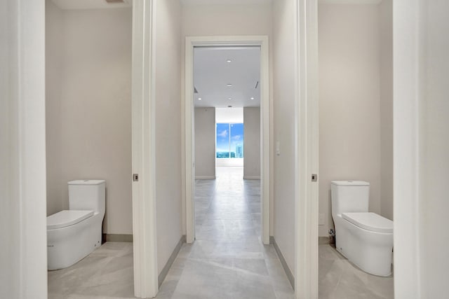 220 SE Mizner Blvd Unit Ph920, Boca Raton, FL 33432 - bathroom featuring toilet and baseboards