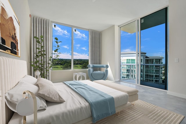220 SE Mizner Blvd Unit Ph920, Boca Raton, FL 33432 - bedroom with expansive windows, multiple windows, concrete floors, and access to outside
