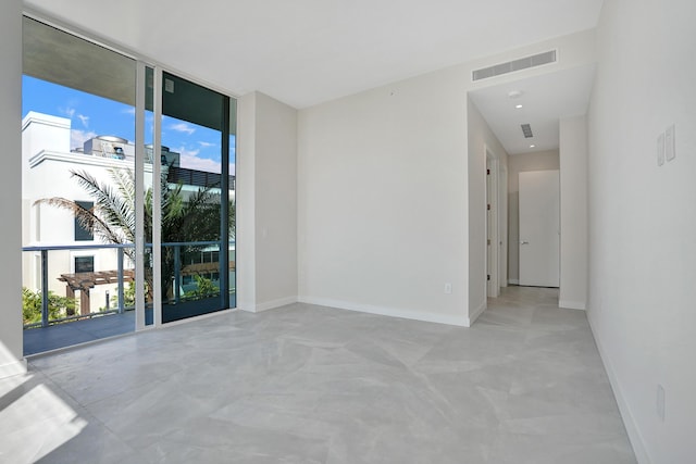 220 SE Mizner Blvd Unit Ph920, Boca Raton, FL 33432 - unfurnished room featuring floor to ceiling windows and baseboards