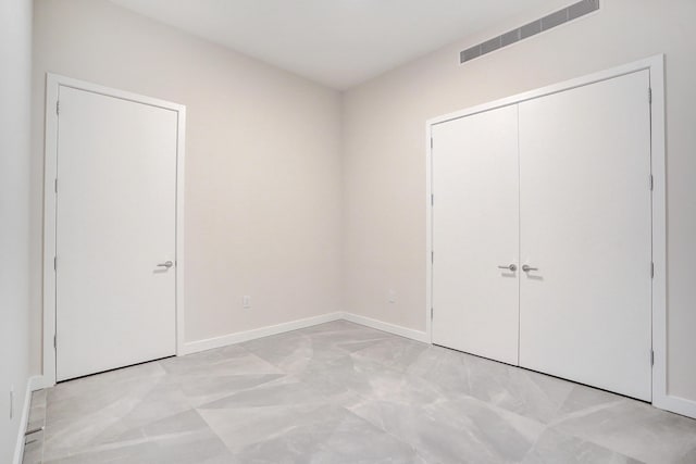 220 SE Mizner Blvd Unit Ph920, Boca Raton, FL 33432 - unfurnished bedroom featuring baseboards and a closet