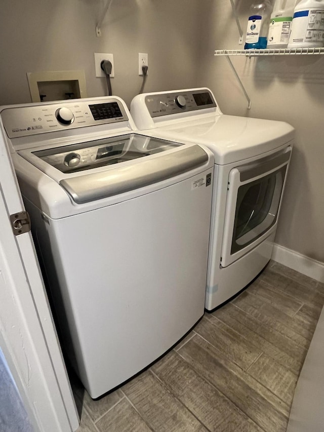 7340 Amberly Ln # 205, Delray Beach, FL 33446 - washroom with laundry area, wood finished floors, and washer and clothes dryer