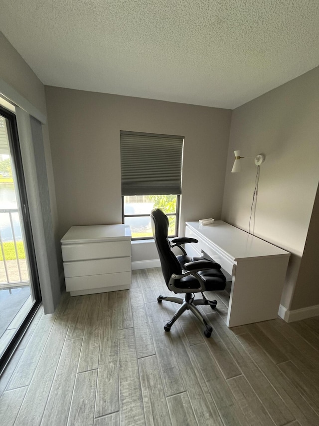 7340 Amberly Ln # 205, Delray Beach, FL 33446 - office space with plenty of natural light, wood finished floors, and a textured ceiling
