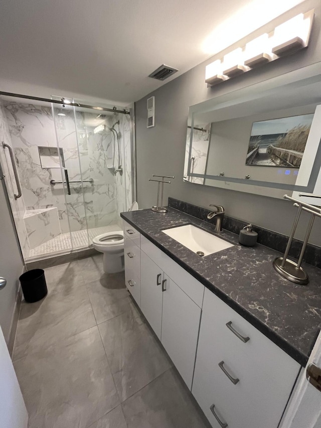 7340 Amberly Ln # 205, Delray Beach, FL 33446 - bathroom featuring toilet, a marble finish shower, visible vents, marble finish floor, and vanity