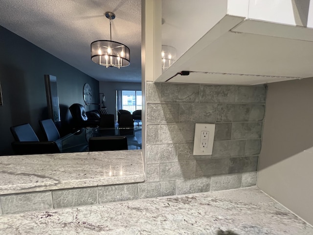 7340 Amberly Ln # 205, Delray Beach, FL 33446 - bathroom with a textured ceiling and a chandelier