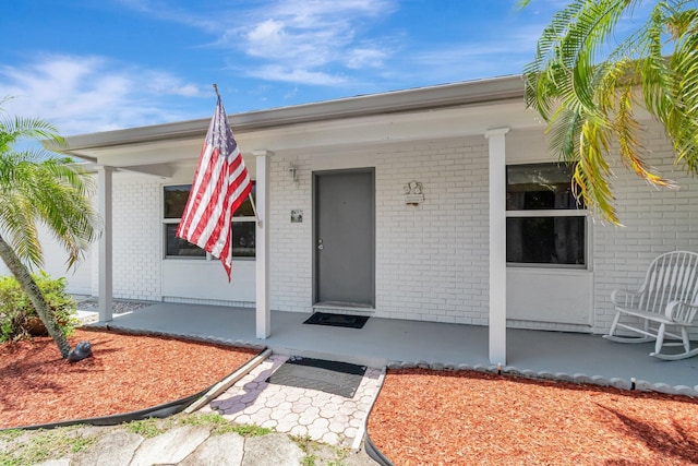 654 Bunting Dr, Delray Beach, FL 33444 - ranch-style house with an attached garage, brick siding, fence, and a front lawn