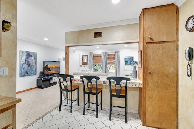 654 Bunting Dr, Delray Beach, FL 33444 - dining space featuring light tile patterned floors, baseboards, ornamental molding, and recessed lighting