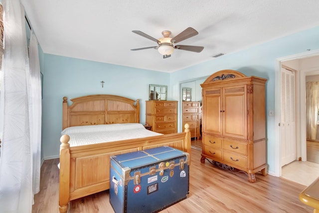 654 Bunting Dr, Delray Beach, FL 33444 - bedroom featuring baseboards, light wood finished floors, visible vents, and a ceiling fan