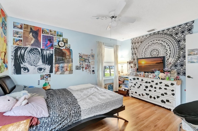 654 Bunting Dr, Delray Beach, FL 33444 - bedroom with visible vents, wood finished floors, and a ceiling fan
