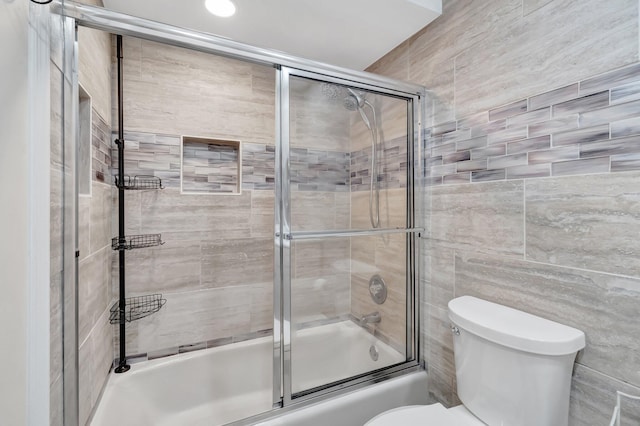 654 Bunting Dr, Delray Beach, FL 33444 - bathroom with combined bath / shower with glass door and toilet