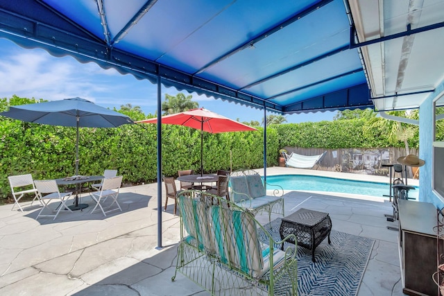 654 Bunting Dr, Delray Beach, FL 33444 - view of pool with a patio, outdoor dining area, a fenced in pool, and a fenced backyard