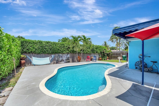 654 Bunting Dr, Delray Beach, FL 33444 - view of pool with a patio area, a fenced in pool, and a fenced backyard