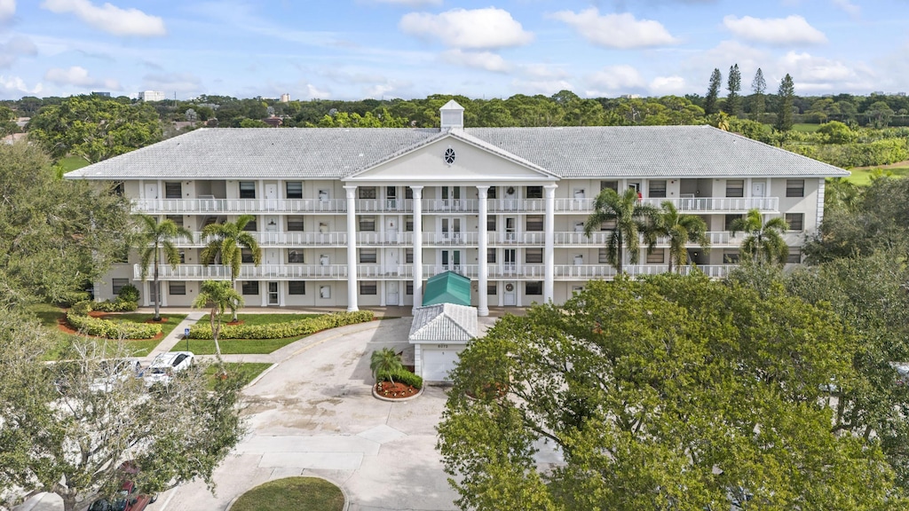 6169 Balboa Cir Unit 101, Boca Raton, FL 33433 - view of building exterior featuring driveway