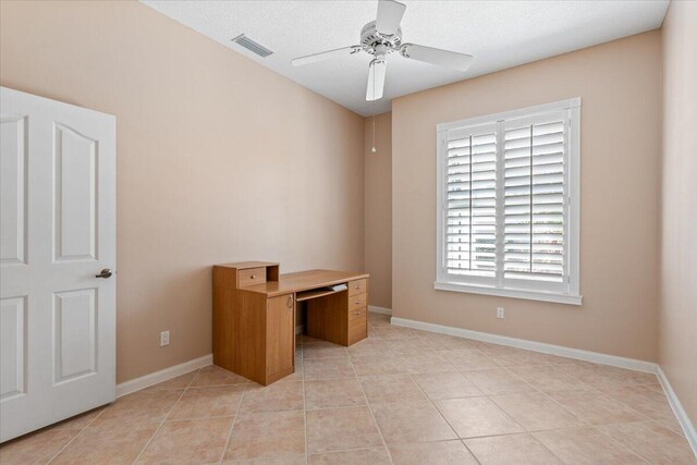 4922 SE Heartleaf Ter, Hobe Sound, FL 33455 - unfurnished office with a ceiling fan, light tile patterned flooring, and baseboards