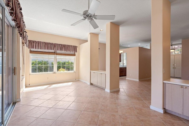 4922 SE Heartleaf Ter, Hobe Sound, FL 33455 - unfurnished room with light tile patterned floors, healthy amount of natural light, a ceiling fan, and recessed lighting