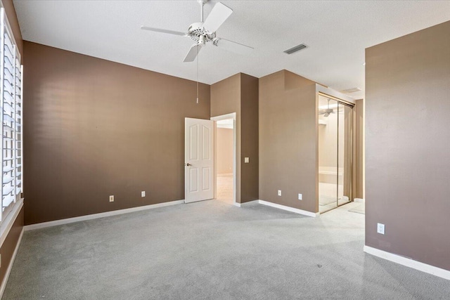 4922 SE Heartleaf Ter, Hobe Sound, FL 33455 - spare room featuring a ceiling fan, carpet flooring, and baseboards