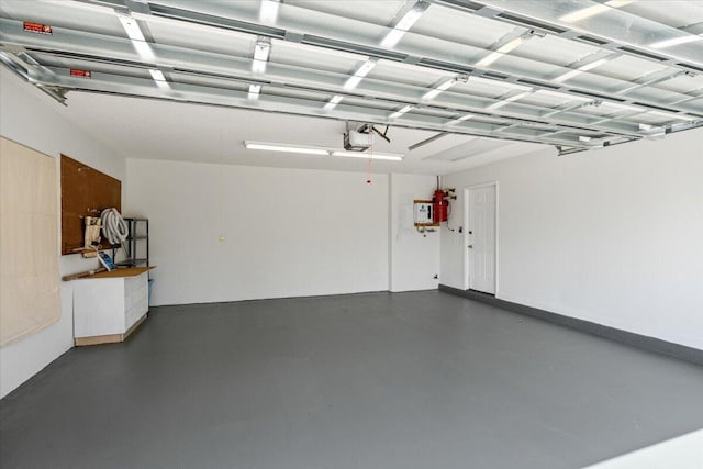 4922 SE Heartleaf Ter, Hobe Sound, FL 33455 - garage featuring a garage door opener
