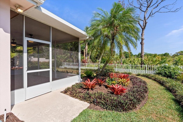 4922 SE Heartleaf Ter, Hobe Sound, FL 33455 - view of yard with a sunroom and fence