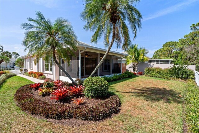 4922 SE Heartleaf Ter, Hobe Sound, FL 33455 - view of yard with a ceiling fan and a sunroom