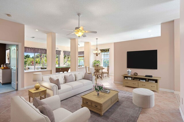 4922 SE Heartleaf Ter, Hobe Sound, FL 33455 - living room with light tile patterned floors, a ceiling fan, baseboards, and recessed lighting