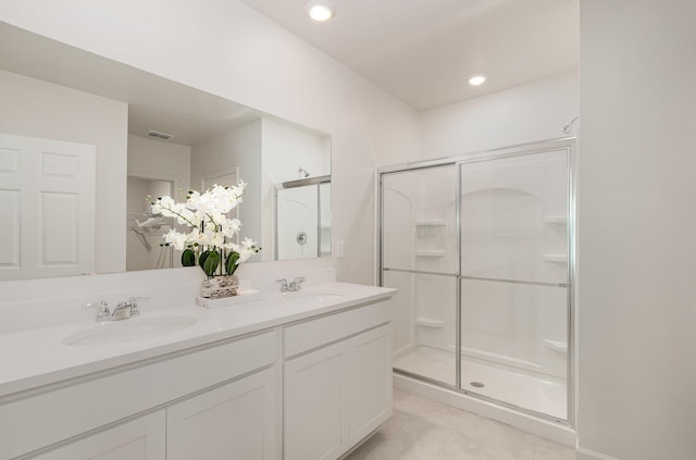 356 SW Prima Vista Blvd, Port Saint Lucie, FL 34953 - full bath featuring double vanity, visible vents, a stall shower, and a sink