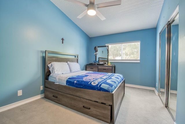 bedroom featuring carpet, a textured ceiling, a closet, and baseboards