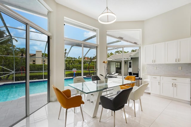 dining area featuring light tile patterned flooring