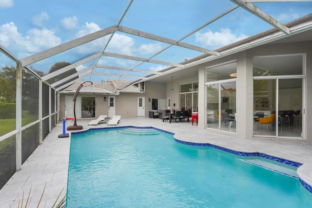 pool featuring a patio area and a lanai