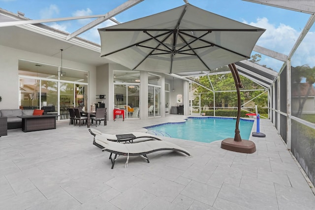 pool with outdoor lounge area, a patio area, and a lanai