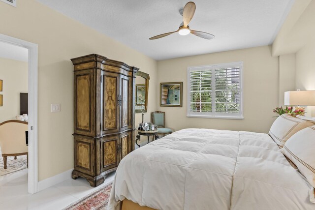 250 NE 3rd Ave Unit 1308, Delray Beach, FL 33444 - bedroom featuring baseboards, ceiling fan, light tile patterned floors, and visible vents