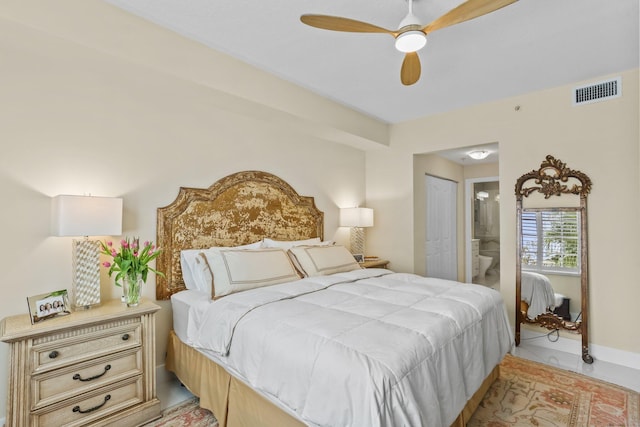 250 NE 3rd Ave Unit 1308, Delray Beach, FL 33444 - bedroom with ceiling fan, ensuite bath, and visible vents