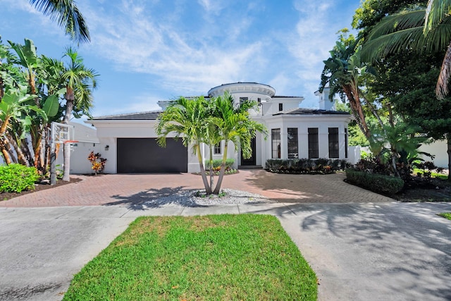 22175 Larkspur Trl, Boca Raton, FL 33433 - view of front of home with decorative driveway, a garage, and stucco siding