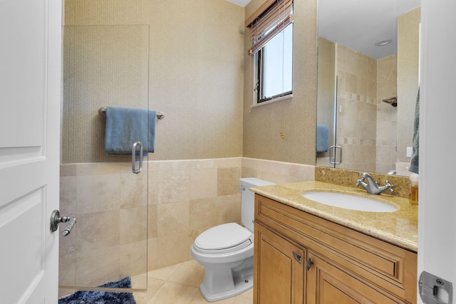 22175 Larkspur Trl, Boca Raton, FL 33433 - bathroom featuring a shower stall, vanity, tile patterned flooring, toilet, and tile walls