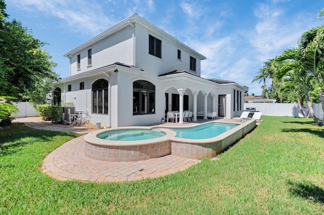 22175 Larkspur Trl, Boca Raton, FL 33433 - rear view of house with stucco siding, a patio area, and a pool with connected hot tub