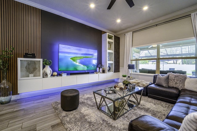 living room with crown molding, recessed lighting, ceiling fan, and wood finished floors