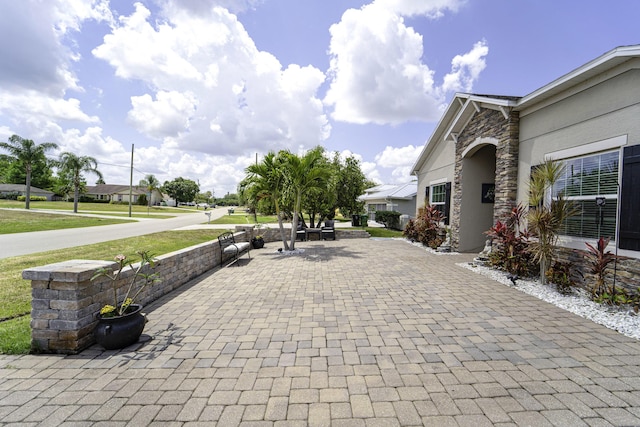 view of patio with decorative driveway