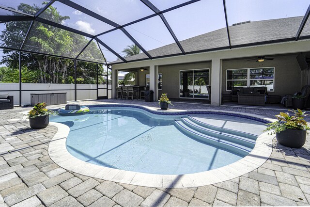 view of pool featuring a patio, an outdoor living space, and outdoor dry bar