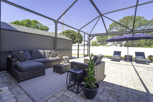 view of patio / terrace with a fenced backyard, a lanai, and outdoor lounge area