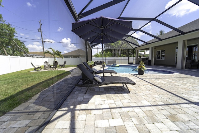 view of patio featuring an outdoor fire pit, a fenced in pool, a fenced backyard, and a lanai